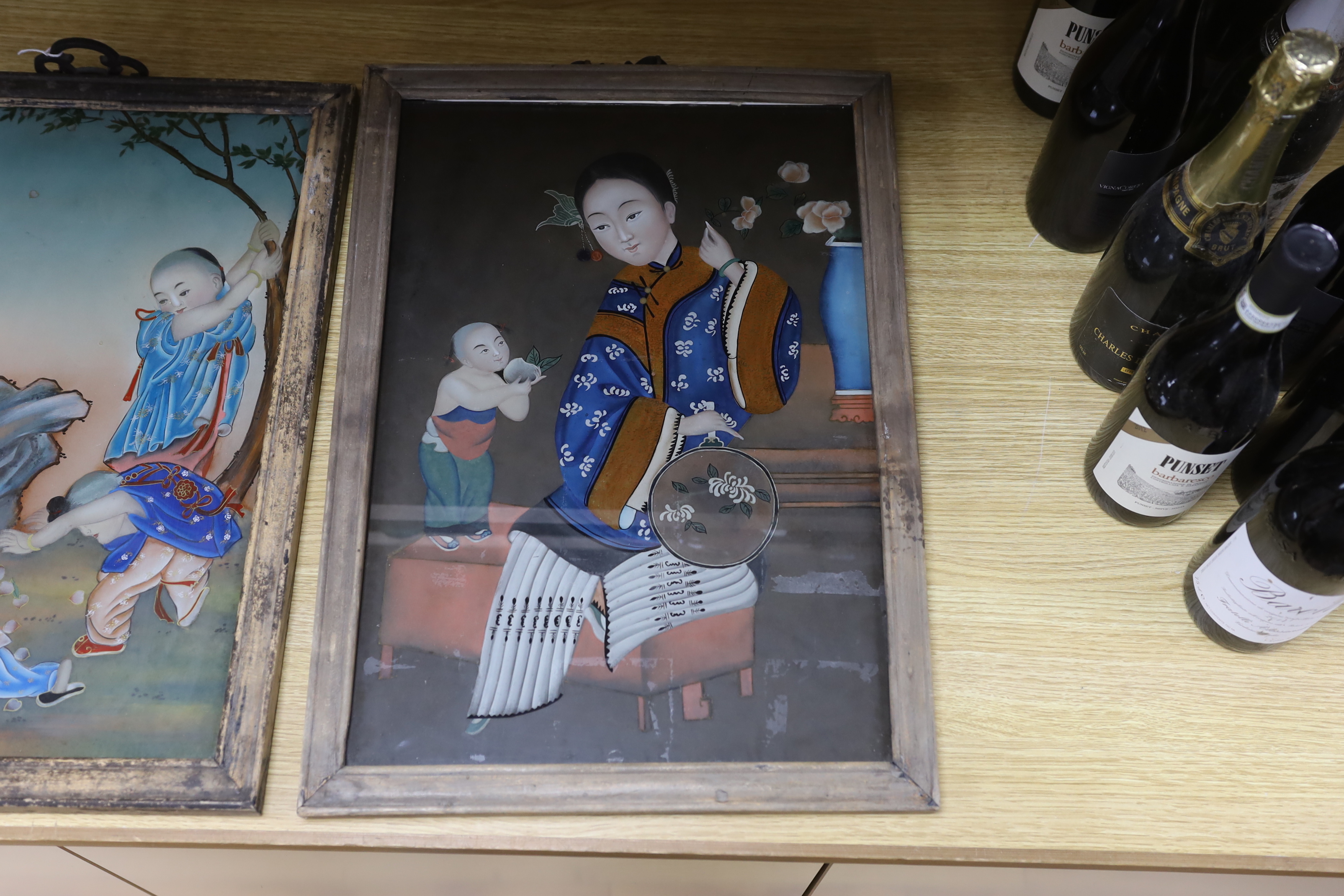 Two Chinese 20th century figural reverse painted glass pictures, framed largest 33cm wide x 49cm